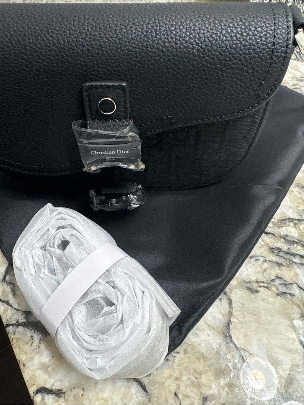 Black Pebbled Leather Crossbody Bag with Signature Clasp
